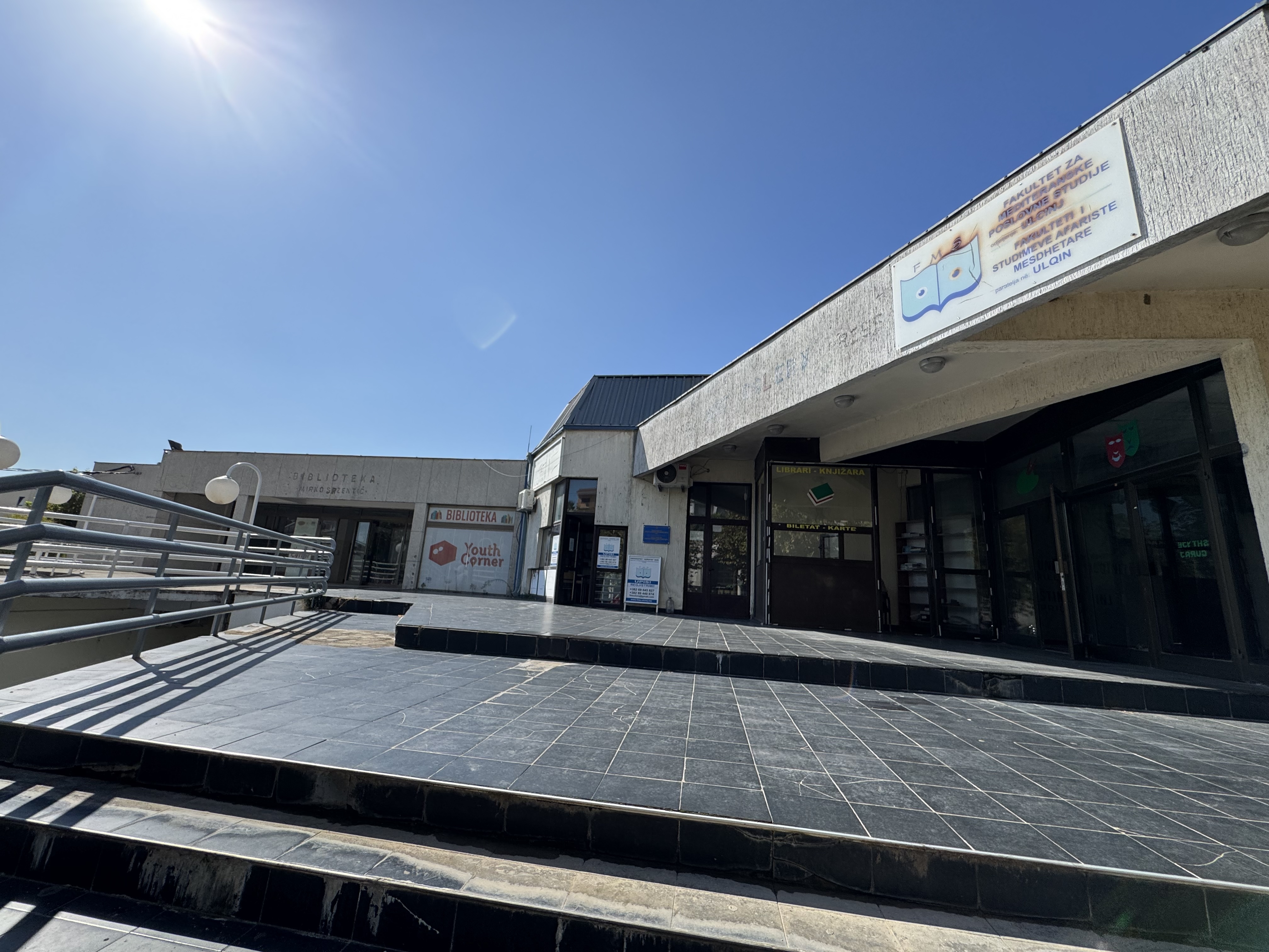 The Library of Ulcinj interior with photographs on the wall